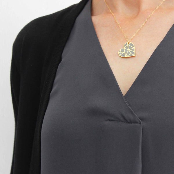 Handmade gold and concrete necklace with a heart pendant, by BAARA Jewelry